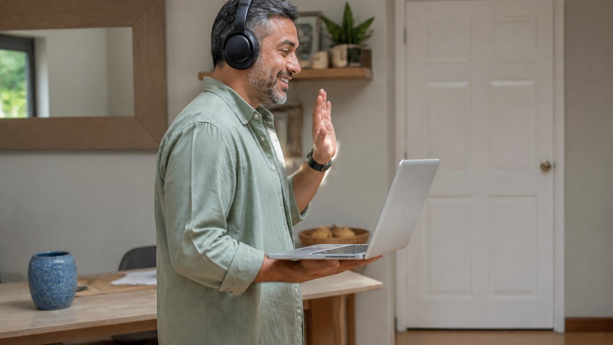 Person wearing headphones on a video call in a quiet room to ensure online therapy privacy at home